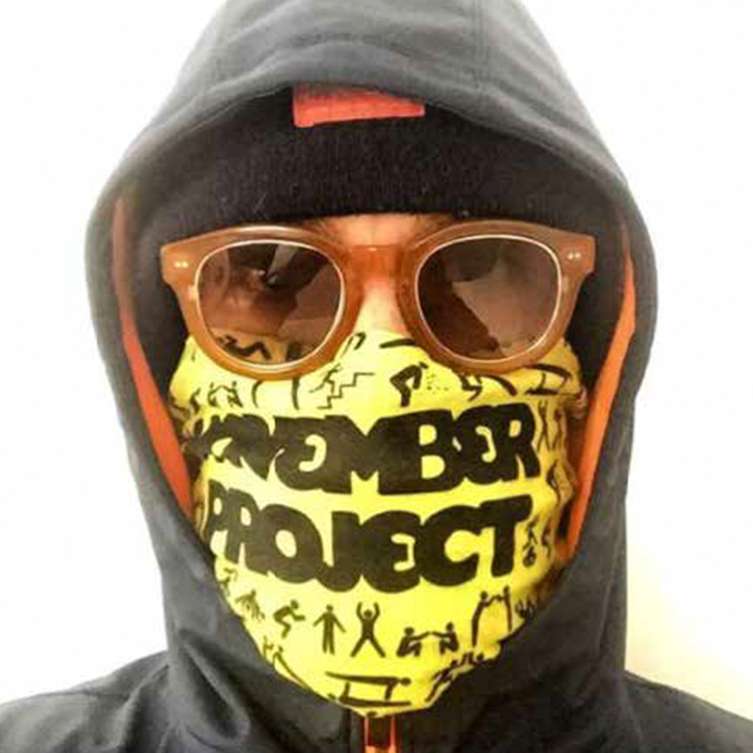 a person wearing a hoodie and sunglasses