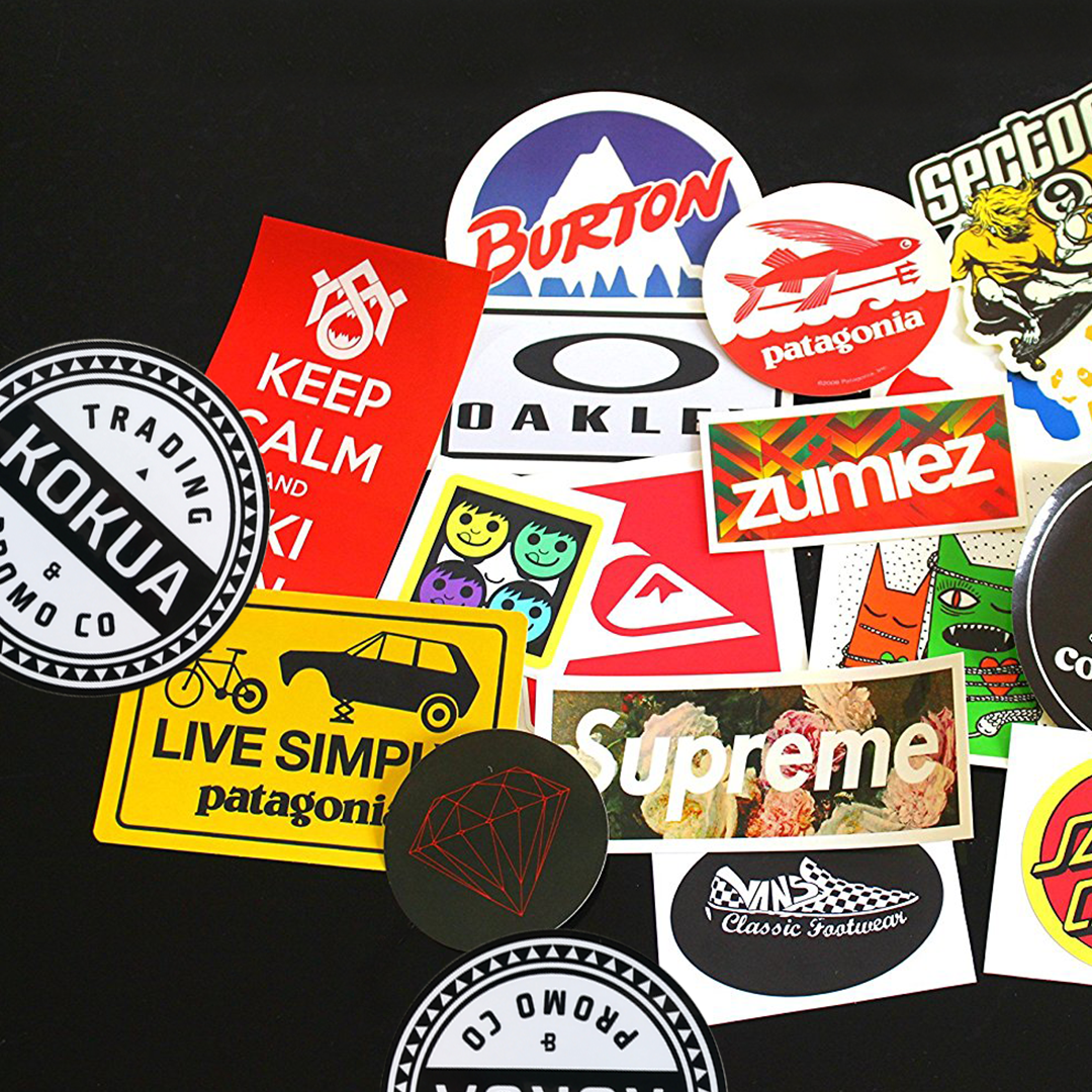 a group of stickers on a black surface