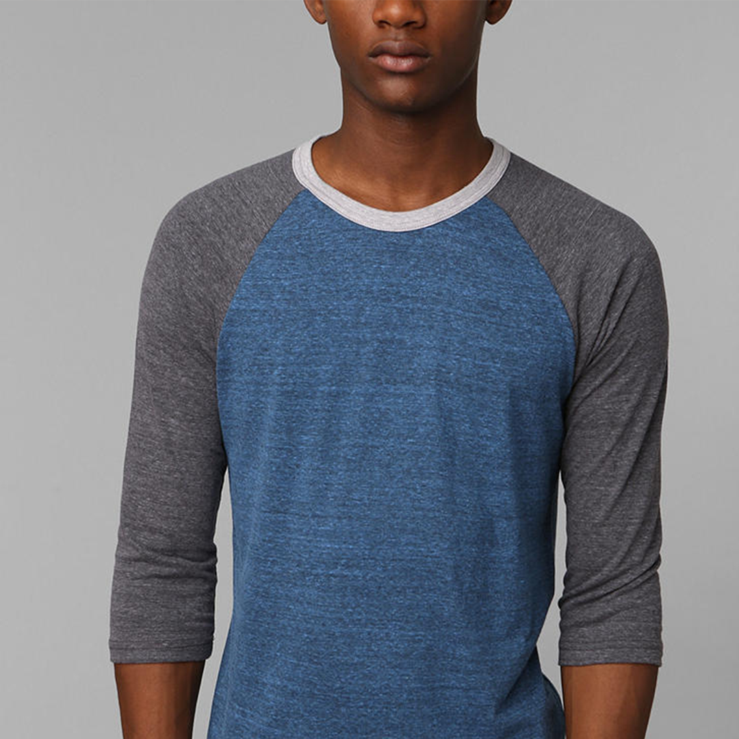 a man in a blue and grey shirt